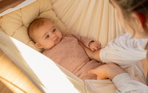 When can babies hold their head up?